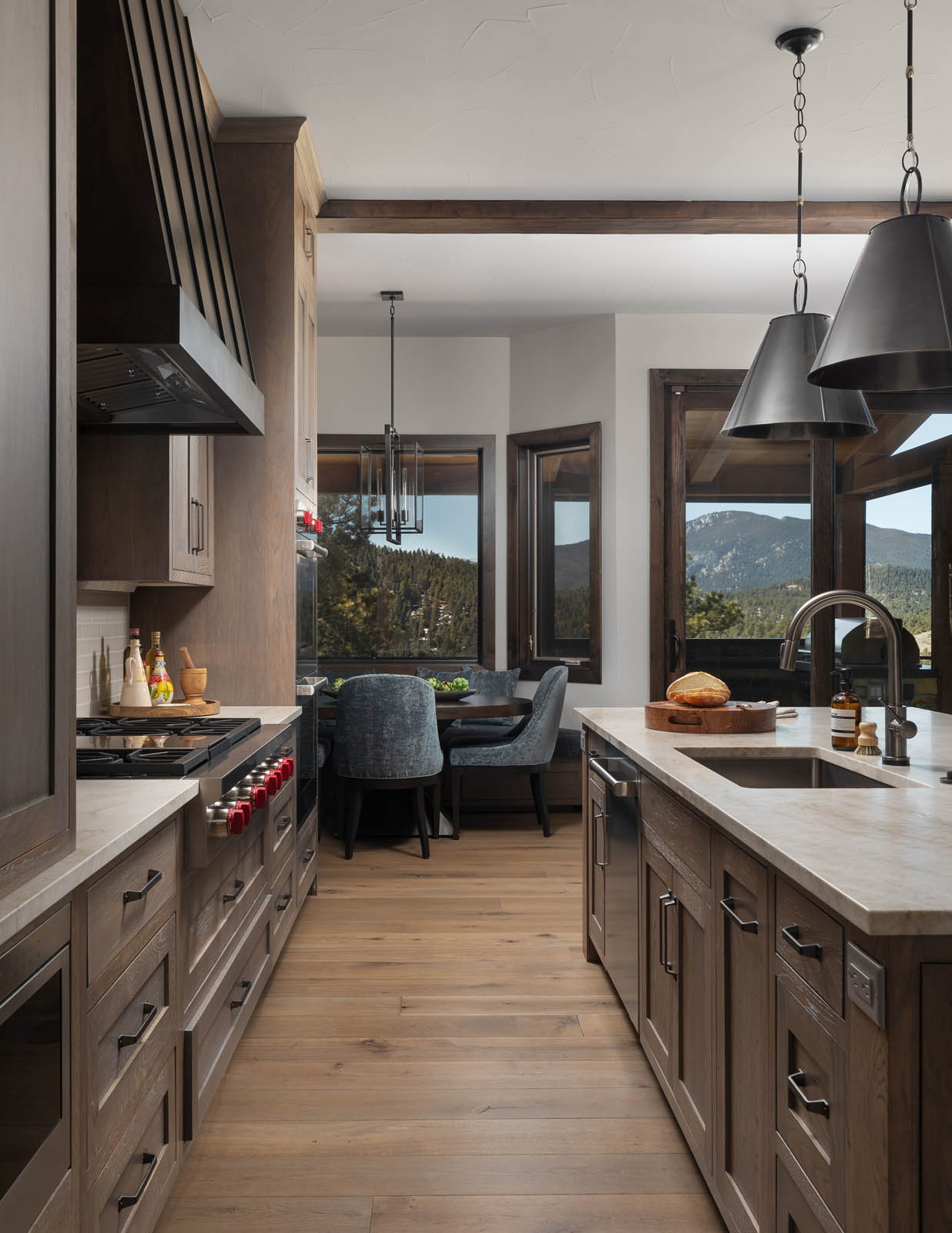 Beautiful kitchen design with mountain range outside the windoes